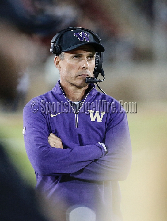 2015StanWash-064.JPG - Oct 24, 2015; Stanford, CA, USA; Washington Huskies head coach Chris Petersen looks at the scoreboard in the fourth quarter against the Stanford Cardinal at Stanford Stadium. Stanford beat Washington 31-14.